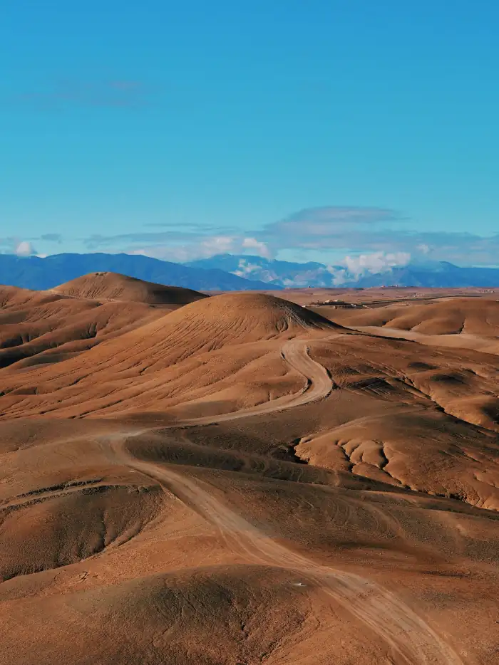 Agafay rocky desert landscape with Atlas Mountains backdrop near Marrakech