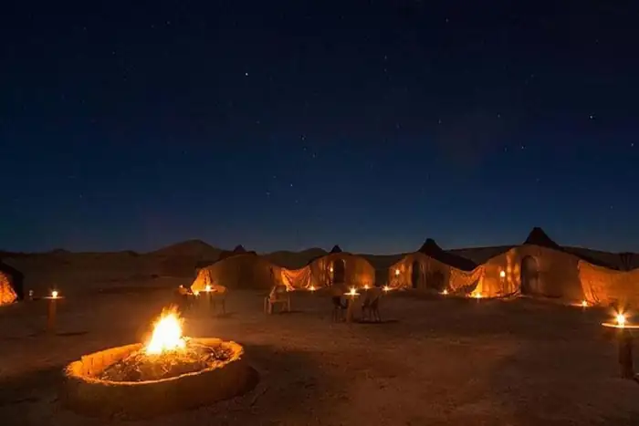 Traditional Berber desert camp in Zagora under starry night sky