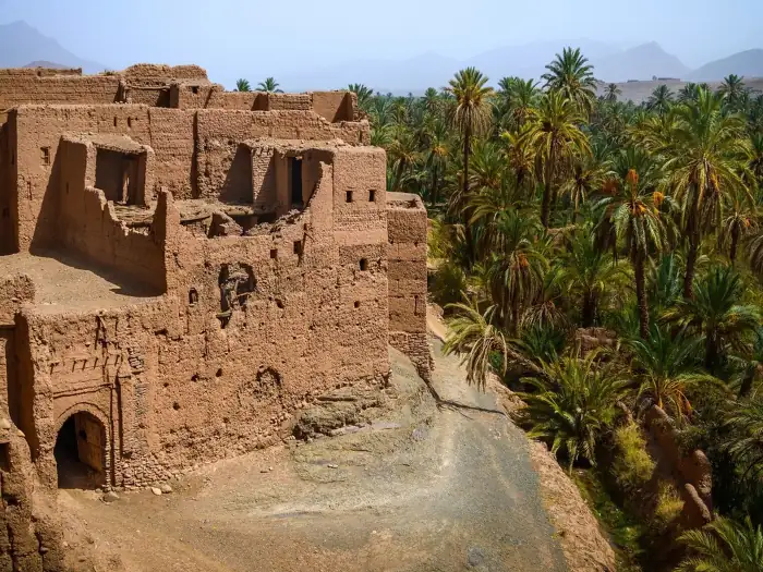 Lush Draa Valley oasis with palm groves and kasbahs in southern Morocco
